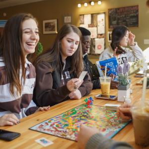 Student play a board game